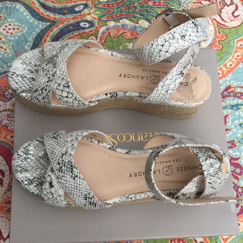 Black and white snake print pattern sandals.